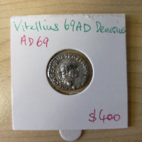 Roman Denarius, Vitellius 69AD, laureate head, dolphin above raven below F/VG