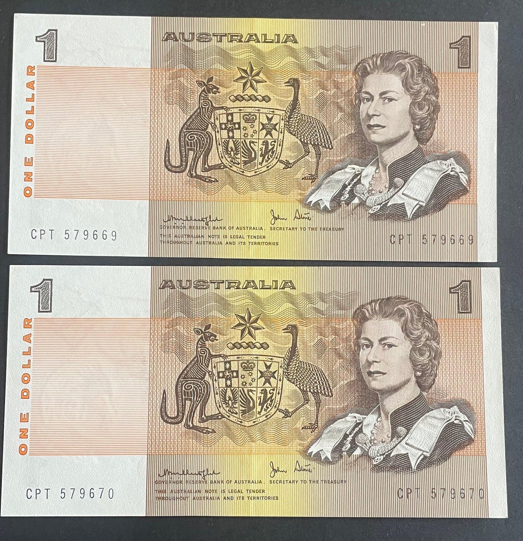 Australia 1977 $1 Knight/Stone about Uncirculated, lightly folded Pair. R77