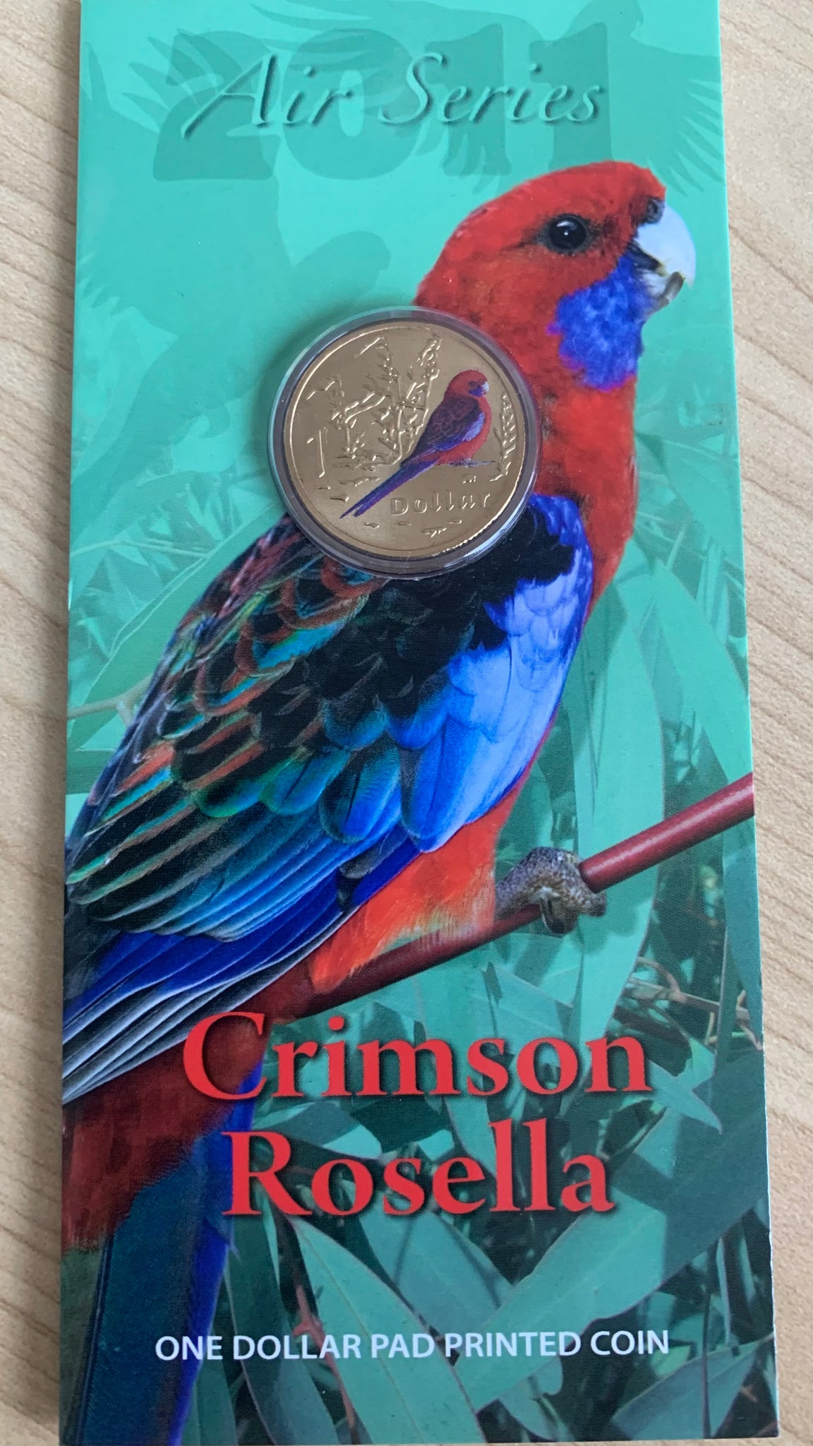 Australia 2011 Royal Australian Mint $1 Air Series Crimson Rosella coloured Carded Coin