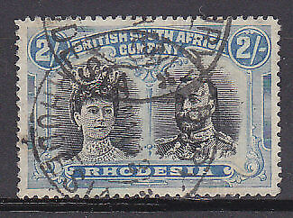 Rhodesia SG 154 2/- blk + dull blue KGV Double Head Used