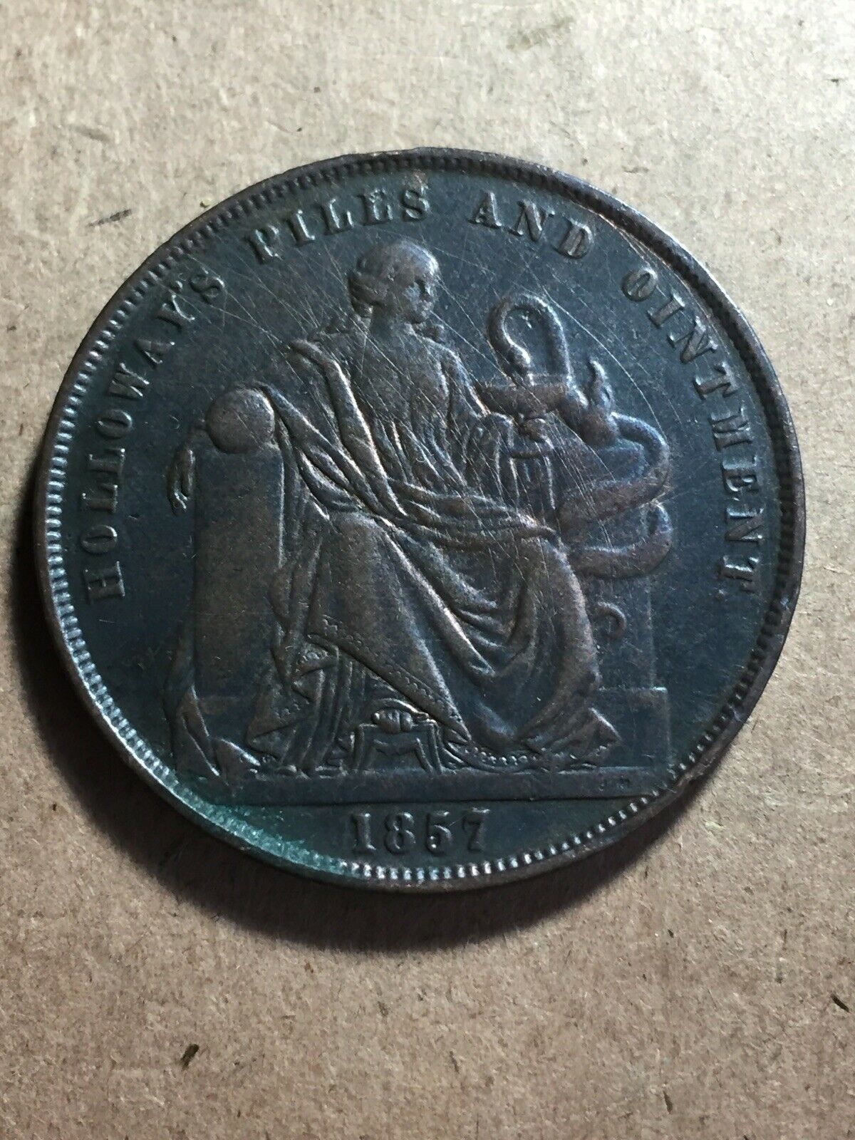 Australia 1857 Holloway’s Pills And Ointment Penny Token.